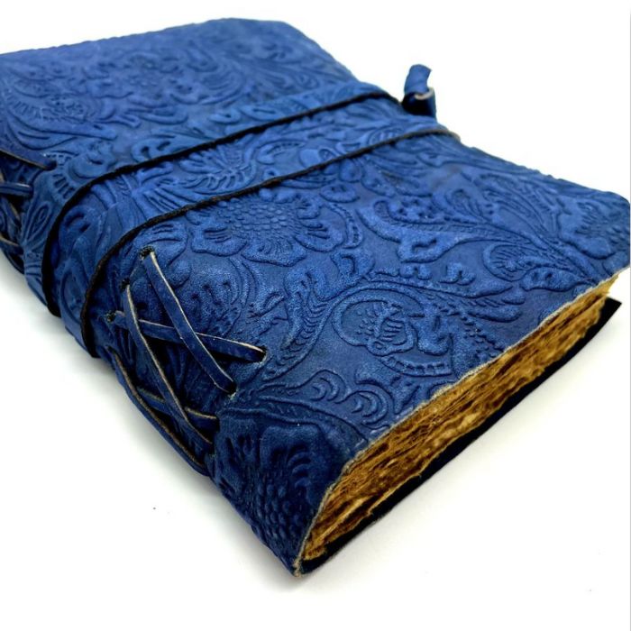 Harper leather bound travel diary with floral embossing on cover and leather strap.