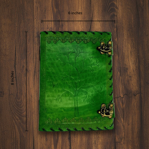 Green leather journal with brass corner clasps, embossed border and stitched edges